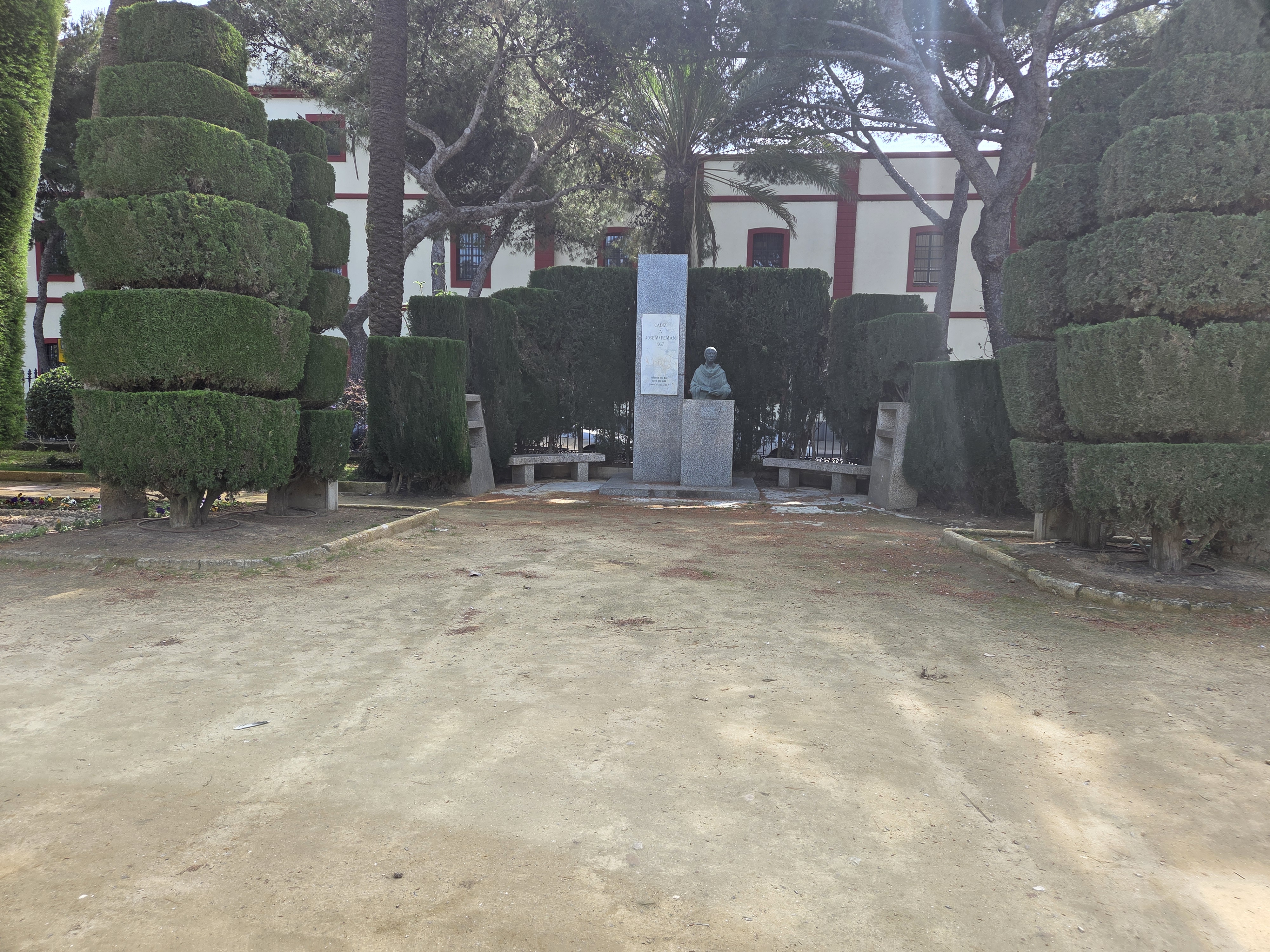 Park monument and manicured trees